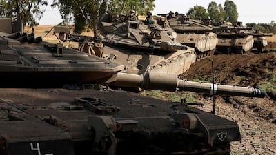Israeli soldiers on the Golan Heights yesterday. The attack on the Golan showed Tehran’s ability ‘to play strong cards’ AFP