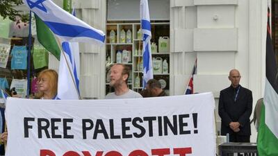 Pro-Palestine and pro-Israel protesters continue their year long demonstrations outside Ecostream, Western Road Brighton. Terry Applin for The National