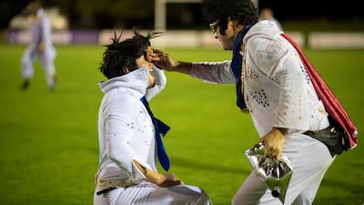 Elvis high-fives Elvis after a good play. Getty Images