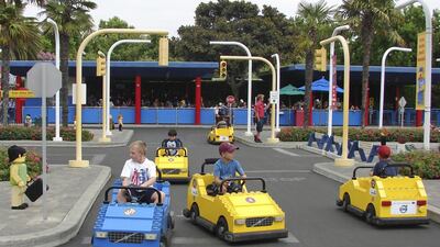 A group of Emirati students will be at Legoland Florida for six months to discover why youngsters such as these get so much enjoyment out of a theme park. Marjie Lambert / Getty Images