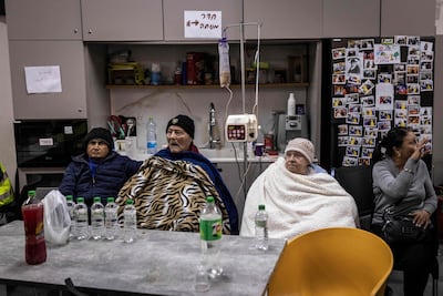 People shelter following a missile attack on Bet Shemesh, 30km west of Jerusalem. AFP