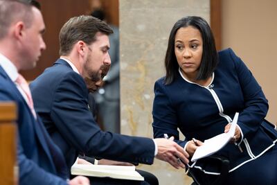 Fulton County District Attorney Fani Willis talks with a member of her team during proceedings to look into the actions of former President Donald Trump and his supporters who tried to overturn the results of the 2020 election. AP