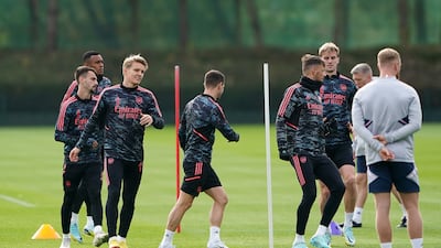 Martin Odegaard with Arsenal teammates during training. PA