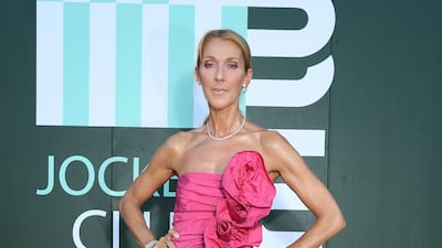 Celine Dion, in hot pink Miu Miu, during Paris Fashion Week on June 29, 2019. Getty Images