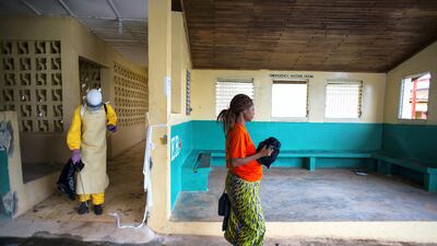 Josephine Flomo, a pregnant patient who was under observation for Ebola symptons, leaves Phebe Hospital in Liberia's Bong county on September 17, 2014 to be taken to a newly opened 50-bed Ebola treatment unit. Michel du Cille / The Washington Post via Getty Images