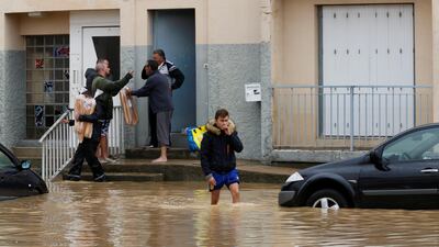 A man wades through the water.