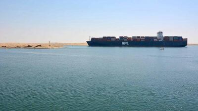 A container vessel passes through the Suez canal, which has generated 5 per cent more revenue for the Egyptian government since it was expanded to add a second lane five years ago. The UAE's National Marine Dredging Company worked on the upgrade. Courtesy NMDC