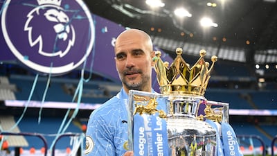 Pep Guardiola with the Premier League trophy on May 23, 2021. Getty