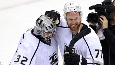 Jonathan Quick, left, and Jeff Carter were heroes for the Los Angeles Kings last night. Todd Karol / Reuters