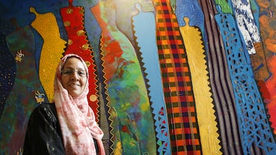 Najat Makki, with her work Illuminant Figures, which is on display in Dubai. Ravindranath K / The National