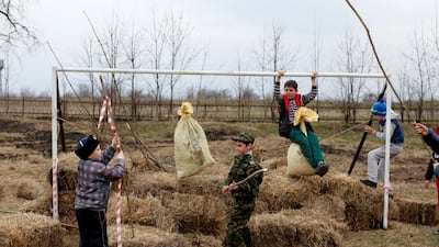Children play at a goalpost during the traditional Cossack games in North Ossetia, Alania, Russia. Eduard Korniyenko / Reuters