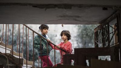 Family members of Abdel Rahman Shaludi, the Palestinian who drove his car into passengers at a railway station causing the death of a 3-month-old baby last month in Jerusalem, look at his destroyed house on November 19 in Jerusalem, Israel. Ilia Yefimovich/Getty Images