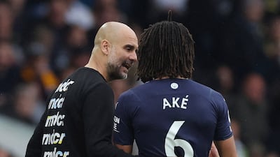 Ake speaks with manager Pep Guardiola after being substituted. Reuters