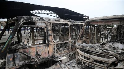 Burnt vehicles are seen at a bus terminal belonging the Lagos government in the Oyingbo district of Lagos, Nigeria, 24 October 2020. EPA