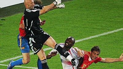 France's keeper Fabien Barthez rises above a crowd of players to clear the ball during the 2006 World Cup quarter-final between France and Spain in Hanover, Germany, which France won 3-1.