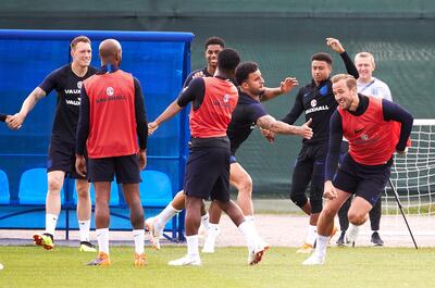 England's Kyle Walker and Harry Kane enjoy a drill during a training session in St Petersburg. Oleg Nikishin / Getty Images