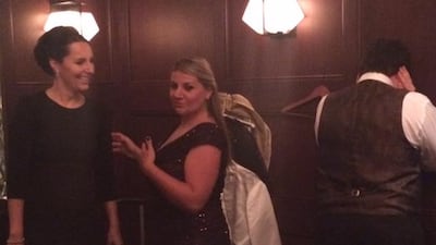 In the back room of The Ivy on Thursday night, opera singers prepare for the show, from left: Maria Glück, Christine Belbelian and, with his back to the camera, Paul Bester. Photo by Ann Marie McQueen