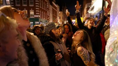 People party on a street as pubs shut for the night due to tier 3 restrictions in Soho, London, Britain. Reuters