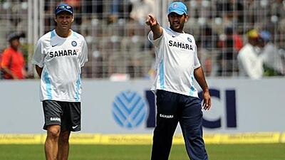 Gary Kirsten, left, is content being behind the scenes.