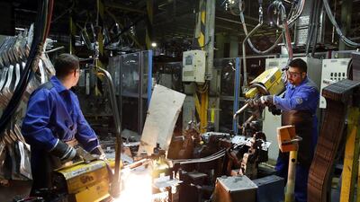 Iranian workers at the Iran Khodro auto plant in Tehran on March 18. Maryam Rahmanian for The National