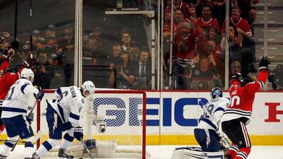 Brandon Saad, right, of the Chicago Blackhawks begins to celebrate after scoring in his team's Game 4 win in the Stanley Cup finals on Wednesday night. Tasos Katopodis / Getty Images / AFP / June 10, 2015