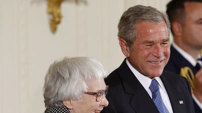 Novelist Harper Lee (1926 - 2016), pictured with George W Bush. EPA