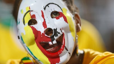 Zimbabwe's soccer team supporter cheers during the group A soccer match between Egypt and Zimbabwe, the opening match of the Africa Cup of Nations at Cairo International Stadium in Cairo, Egypt, Friday, June 21, 2019. (AP Photo/Ariel Schalit)