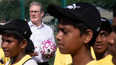 UK Prime Minister Keir Starmer meets young players at a Premier League training facility in Mumbai. Getty Images