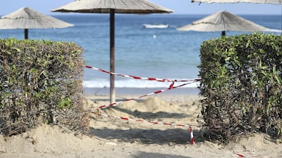 Paths to the beach are closed on Monday as workers try to clear up the oil. Chris Whiteoak / The National