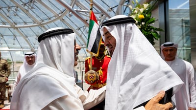 President Sheikh Mohamed is greeted by Sheikh Meshal, Emir of Kuwait, on Thursday. Hamad Al Kaabi / UAE Presidential Court