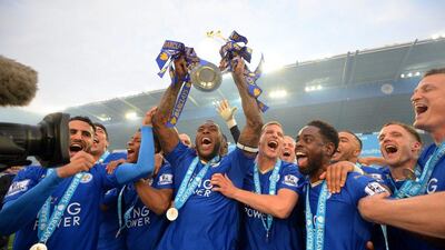 Leicester City captain Wes Morgan lifts the Premier League trophy. Michael Regan / Getty Images