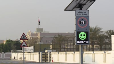 Smart signs installed in school zones flash happy orsad emojis depending on the driver's speed. RTA