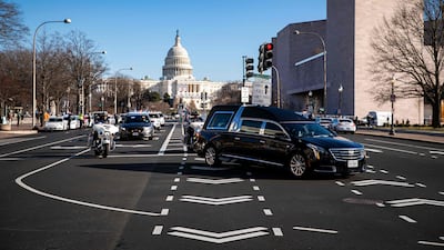 A hearse carries the casket of US Capitol Police Officer Brian Sicknick on January 10, 2021, during a police procession in Washington. AFP
