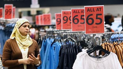 Shoppers browse at the Dubai Outlet Mall in Dubai. Consultants say there is tension in Dubai's retail sector. Satish Kumar / The National