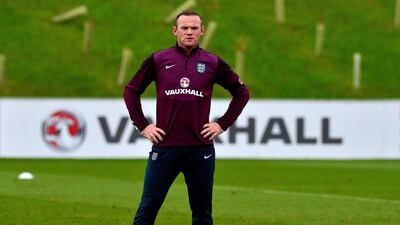 Wayne Rooney takes part in a training session on Tuesday ahead of England's Euro 2016 qualifier against Slovenia on Saturday. Paul Ellis / AFP / November 11, 2014
