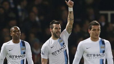 Alvaro Negredo, centre, scored twice for Manchester City on Tuesday. Stefan Wermuth / Reuters