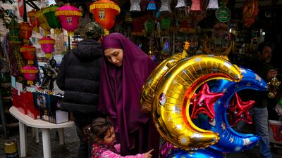 People shop for decorations at a shop in Beirut, Lebanon. AP