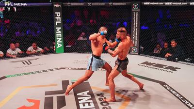 Ali Taleb, left, engages with Nawras Abzakh.