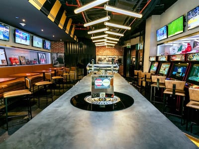 As well as watching the Olympics, visitors at Stars N Bars, Yas Marina, can also play video games, pinball and foosball. Photo: Stars N Bars