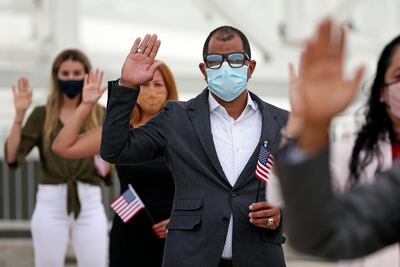 Residents of Florida take the oath to become citizens of the United States during a naturalisation ceremony in Jacksonville. AP Photo