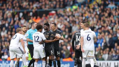 Thomas Partey of Arsenal clashes with Tyler Adams of Leeds. Getty