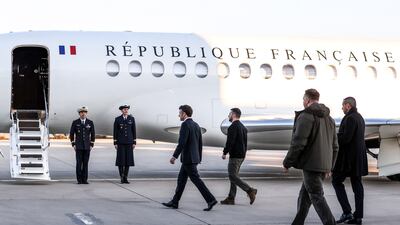 Mr Macron and Mr Zelenskyy board their plane to Brussles. EPA