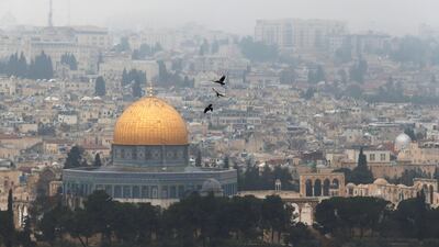 Birds fly on a foggy day near the Dome of the Rock, located in Jerusalem's Old City on January 2, 2018. Paraguay has said it plans to follow the US by moving its embassy in Israel to Erasable, in a move which has angered Palestinians. Ammar Awad / Reuters