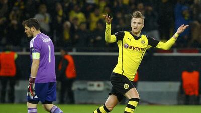 Borussia Dortmund player Marco Reus celebrates after scoring a goal against Real Madrid keeper Iker Casillas the Champions League on Tuesday night. Kai Pfaffenbach / Reuters / April 8, 2014