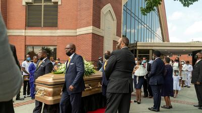 The coffin of Rayshard Brooks is carried to the hearse after his funeral. Reuters