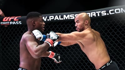 Emilio Quissua throws a punch at Kevin Oumar at the Etihad Arena in Abu Dhabi.