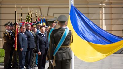 Ukraine's new president Volodymyr Zelenskiy attends a flag raising ceremony after his inauguration in the capital Kiev on May 20, 2019. Ukrainian Presidential Press Service/Handout via REUTERS