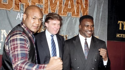 George Foreman, Donald Trump and Evander Holyfield pose during a press conference to promote their upcoming fight on April 19,1991 in Atlantic City, New Jersey. Getty