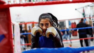 A Palestinian girl, Farah Abu Al-Qomsan, 15, warms up during training inside the first women boxing center in Gaza City January 17, 2023. REUTERS / Mohammed Salem