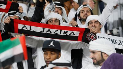 Al Jazira fans hold up banners before the match. Reuters